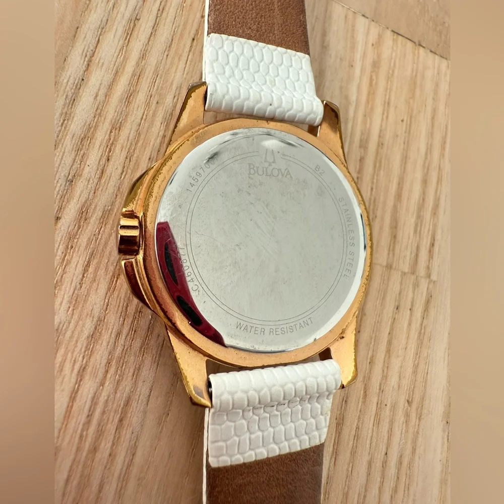 Bulova ladies 98P119 rose gold tone white leather watch NEW BATTERY